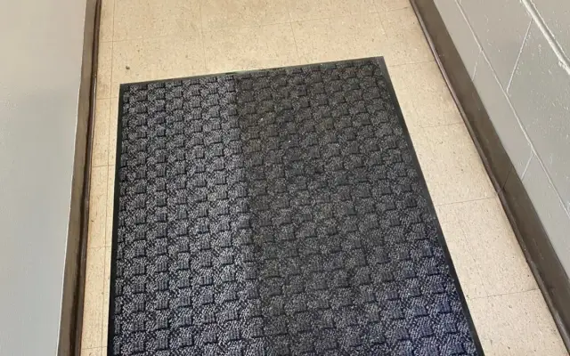 Commercial walk-off mat being cleaned