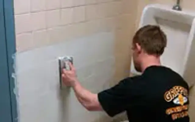 Griffith Construction skim coating a wall