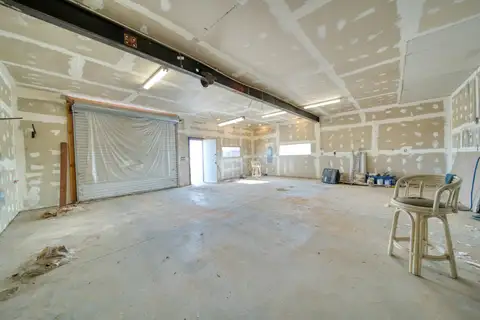 Commercial space with walls and ceiling taped and mudded