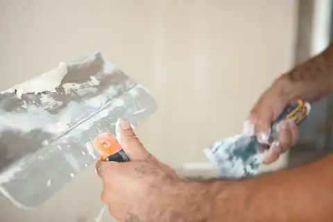 Applying joint compound with taping knives